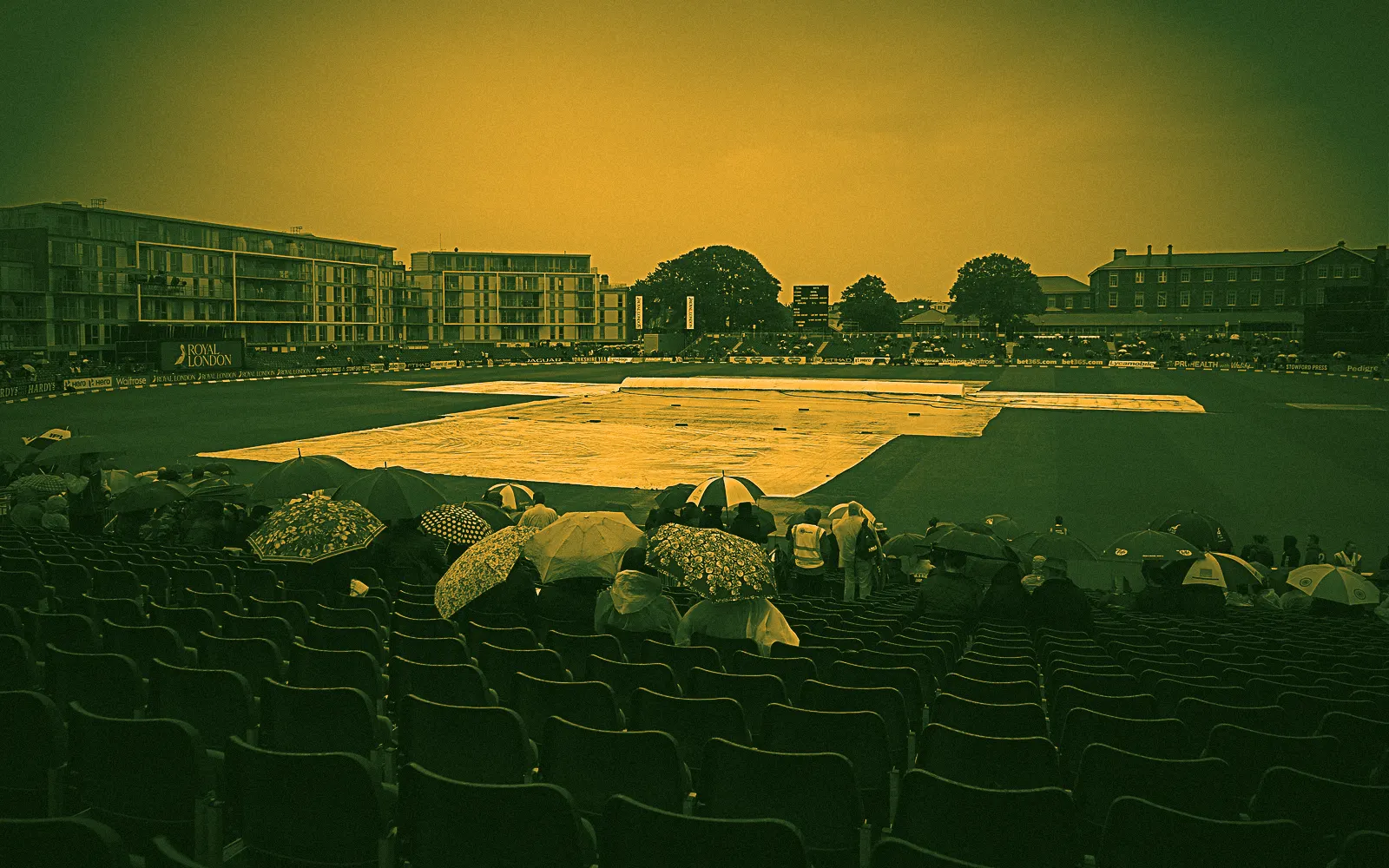 Umbrellas up and the covers on at Bristol County Ground